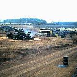 "ABtry 6/27th Arty Firing Battery Area - Quan Loi Airstrip in Background - April 1968"